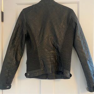 Guess leather jacket. The leather quality is beautiful and in great condition.